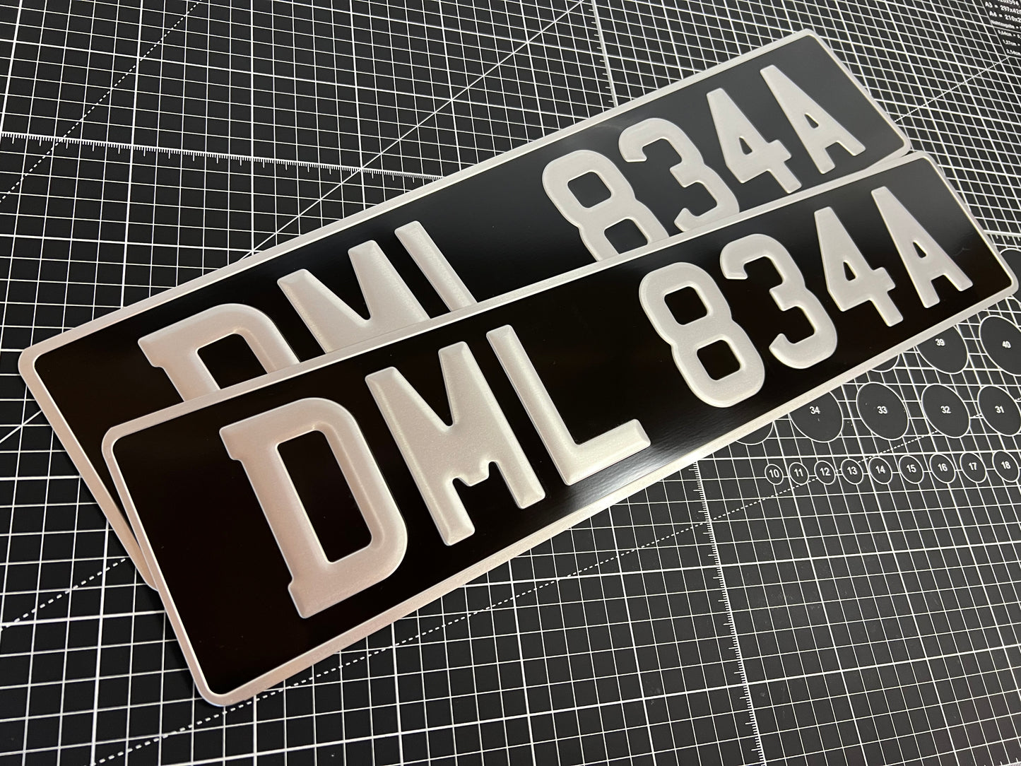 Pressed metal pair black and silver number plates