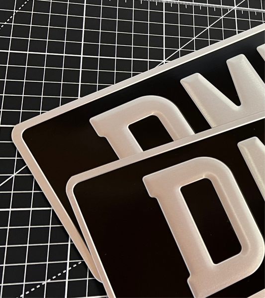 Pressed metal black and silver plates with square rear